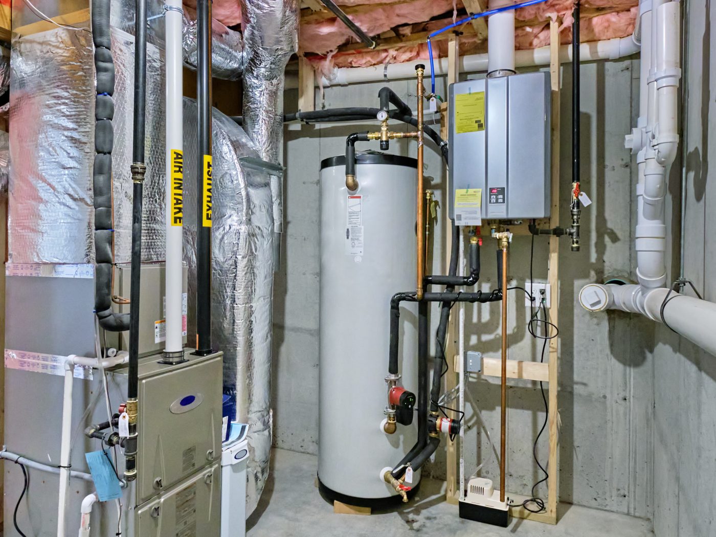 Residential furnace and water heater in a North Central Iowa basement mechanical room.