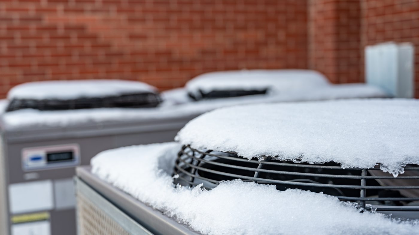Snow piled on outdoor condensers near Fort Dodge during a North Central Iowa winter.